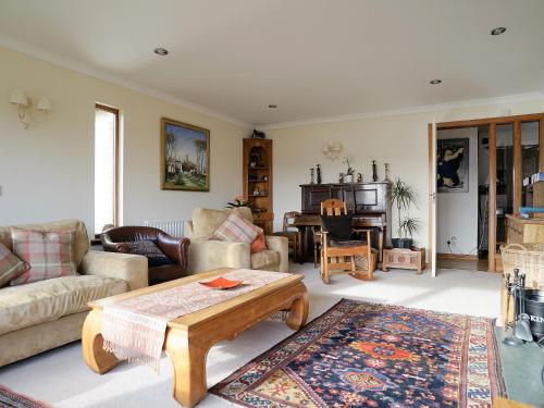 a living room with a couch and a coffee table at Rosmuire in Rhu