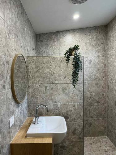 a bathroom with a sink and a mirror at Robe Holiday Park in Robe