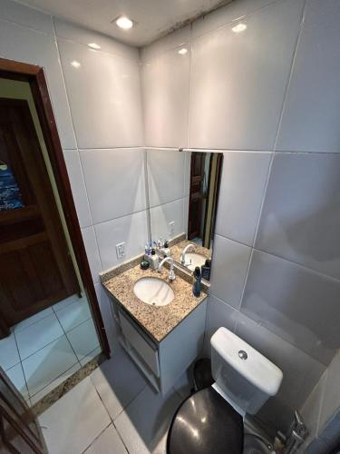 a bathroom with a sink and a toilet at Apto Cop30 - Ideal BR - Completo in Ananindeua