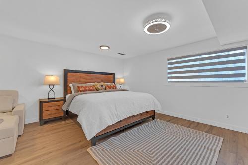 a bedroom with a bed and a couch and a window at Evergreen Garden Wi-Fi available close to Nike Intel Hospital Downtown in Portland