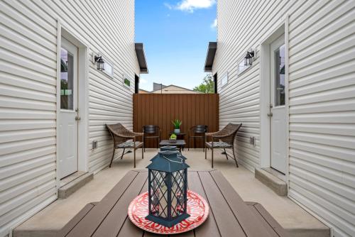 a patio with a lantern on a wooden table at Whole Home 1012 & 1014 Franklin in Clarksville