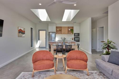 a living room with a couch and a table and chairs at BIG4 Launceston Holiday Park in Launceston