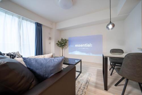 a living room with a couch and a table at MD302 Super rare location! 2bedroom!Home Theater! in Sapporo