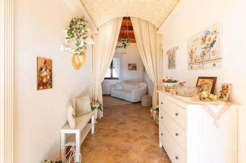 a room with a white dresser and a living room at Il Rifugio della Quiete in Scicli