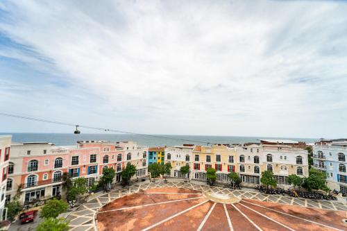 a view of a city with buildings at Novus Sol Hotel & Apartment Sunset Town Phu Quoc in Phu Quoc