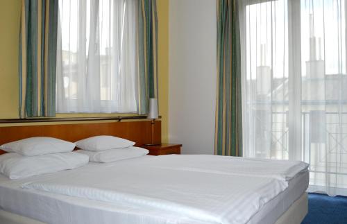 Кровать или кровати в номере Hotel Veritas
