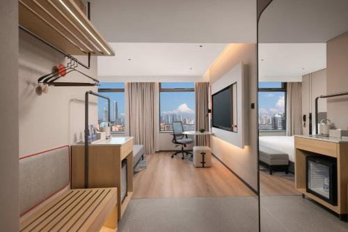 a hotel room with a view of a city at Holiday Inn Express Wuhan Jianghan Road by IHG in Wuhan