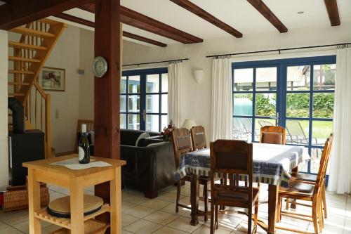 a living room with a table and a dining room at Landhaus 2 Stettinerhaff in Dargen