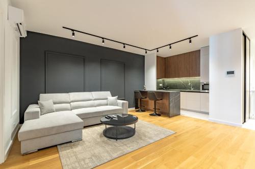 a living room with a couch and a table at Park Vila Apartments in Belgrade