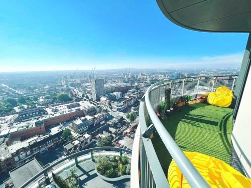 an observation deck on a building with a view of a city at Luxury 1-Bedroom Apt with Stunning London Views in Barking