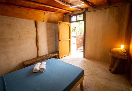 Postel nebo postele na pokoji v ubytování Glamping Solferino-Holbox Coast