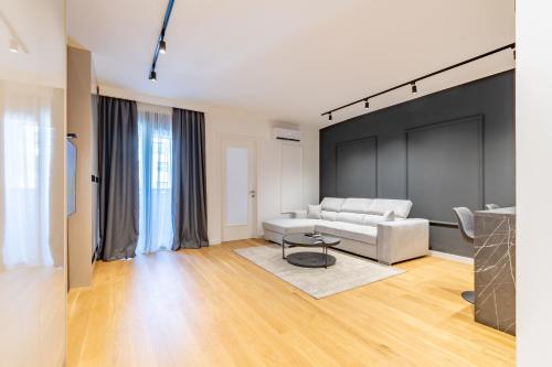 a living room with a couch and a table at Park Vila Apartments in Belgrade