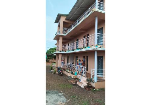 a view of the front of a house at Panchgani Palace in Panchgani