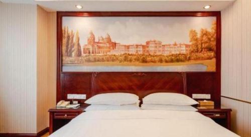 Letto o letti in una camera di Vienna Hotel Nanning Train Station