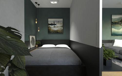 ソポトにあるSopot Apartament Monte Cassinoのベッドルーム(ベッド1台、ソファ付)