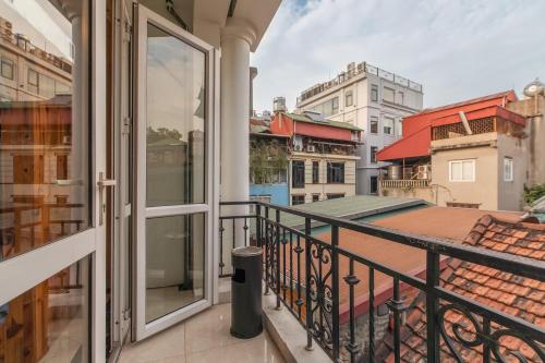 a balcony with a view of a city at Hanoi Central Pod in Hanoi