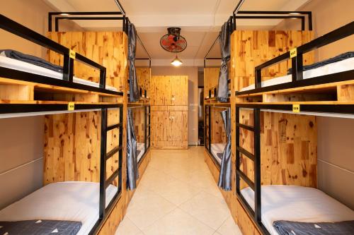 a row of bunk beds in a room at Hanoi Central Pod in Hanoi