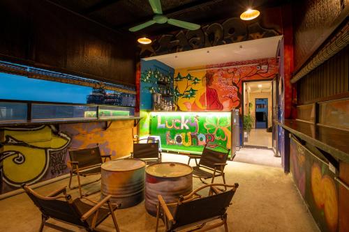 a room with chairs and a table and barrels at Hanoi Central Pod in Hanoi
