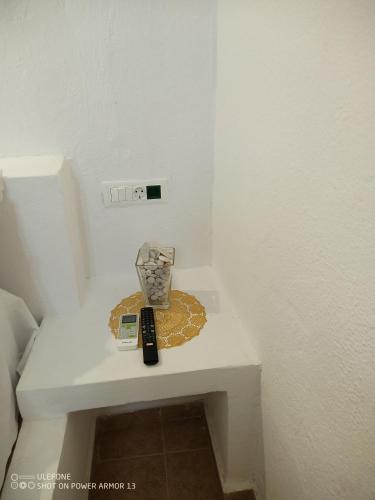 a remote control sitting on a table in a room at ''RENATA'' Studio in Kithnos