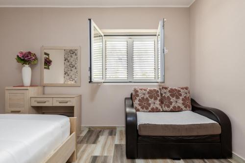 Ένα ή περισσότερα κρεβάτια σε δωμάτιο στο Apartments Krstos place
