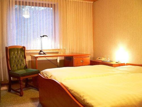Voodi või voodid majutusasutuse Siegerland-Hotel toas
