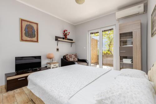 Ένα ή περισσότερα κρεβάτια σε δωμάτιο στο Apartments Krstos place