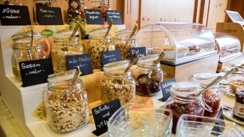 a display of jars of food on a table at Gasthaus Otto in Königswinter