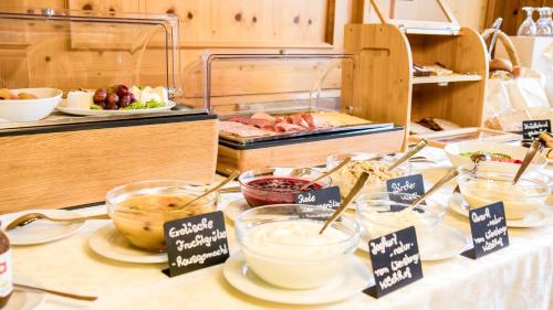 a buffet with bowls of food on a table at Gasthaus Otto in Königswinter