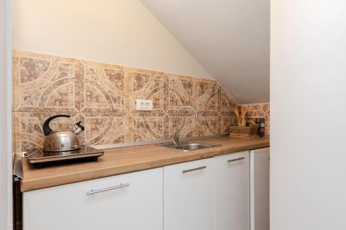 Η κουζίνα ή μικρή κουζίνα στο Apartments Krstos place