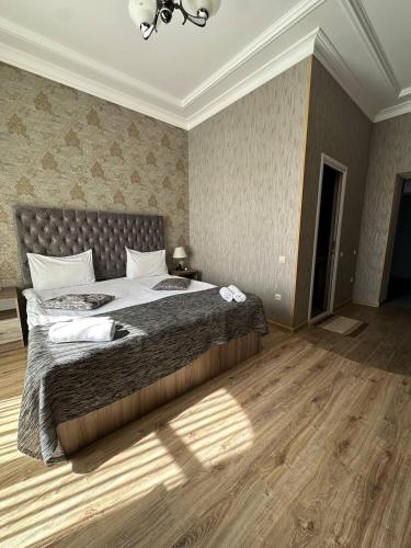 a bedroom with a large bed in a room at Jermuk Moscow Health Resort in Jermuk