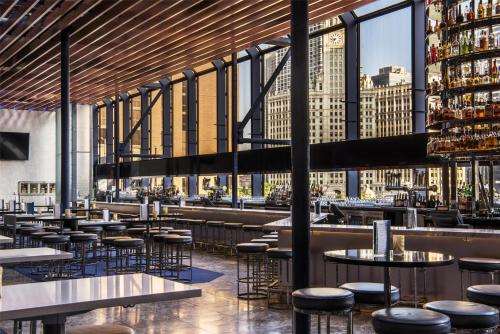 a view of a restaurant with tables and stools at Hyatt Regency Chicago in Chicago