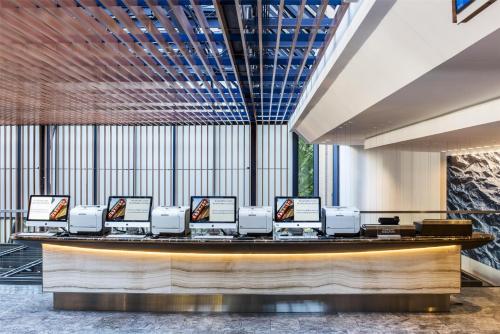 a large lobby with a reception counter with computers at Hyatt Regency Chicago in Chicago