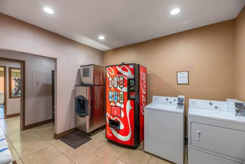 a red refrigerator in a room with a washer and dryer at Arroyo Pinion Hotel, an Ascend Collection Hotel in Sedona