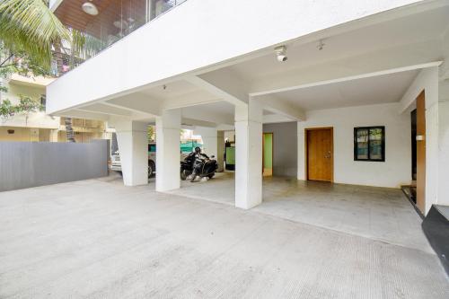 an open floor plan of a house with white columns at FabHotel Sai Raj - Nr Zeel College in Pune