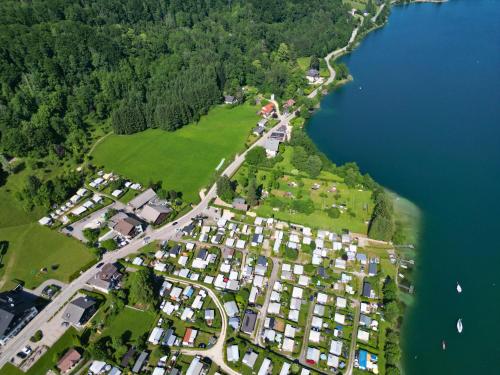 an aerial view of a large group of houses next to a lake at Schönster Seeblick am Mondsee - Cubes - SELF CHECK-IN in Mondsee