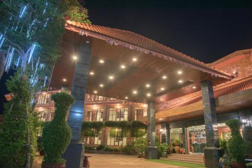 a building with lights on it at night at Busyarin Hotel in Nong Khai