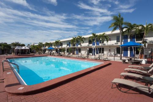 a large swimming pool in front of a hotel at Days Inn by Wyndham St. Petersburg / Tampa Bay Area in St Petersburg
