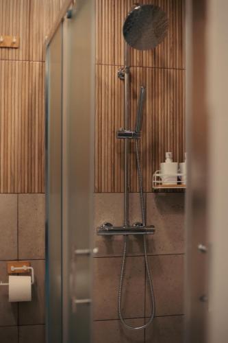 a shower in a bathroom with a glass door at Apartment in Dreverna I Near Lagoon I in Dreverna