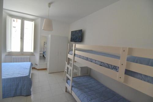 Ένα ή περισσότερα κρεβάτια σε δωμάτιο στο Residenza Antiche Mura