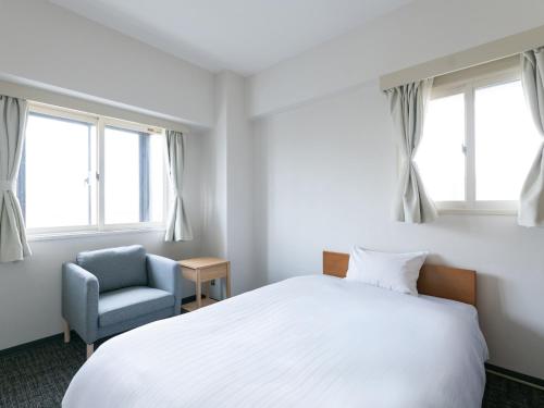 Apartment Hotel DIG the OSAKAにあるベッド