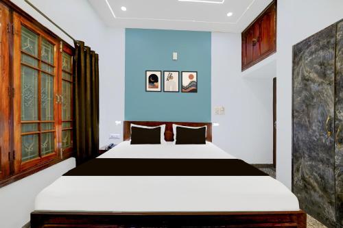 Ένα ή περισσότερα κρεβάτια σε δωμάτιο στο Hotel O Panda Celebration