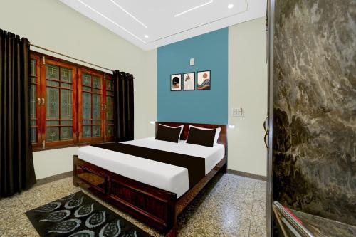 Ένα ή περισσότερα κρεβάτια σε δωμάτιο στο Hotel O Panda Celebration
