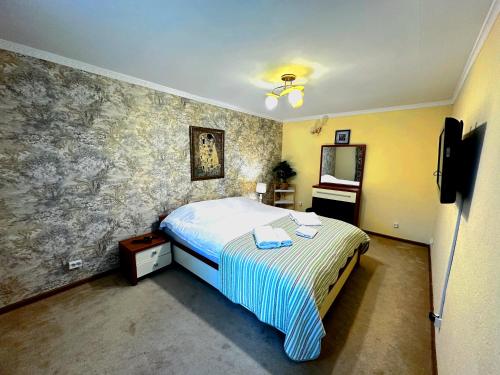 a bedroom with a bed and a tv in it at Sky Village, Chimgan in Chimgan