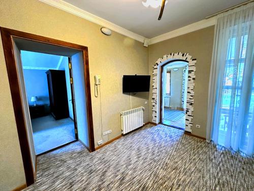 an empty room with an open door with a mirror at Sky Village, Chimgan in Chimgan