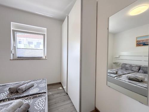 Ένα ή περισσότερα κρεβάτια σε δωμάτιο στο Comfortable Apartments Marijana