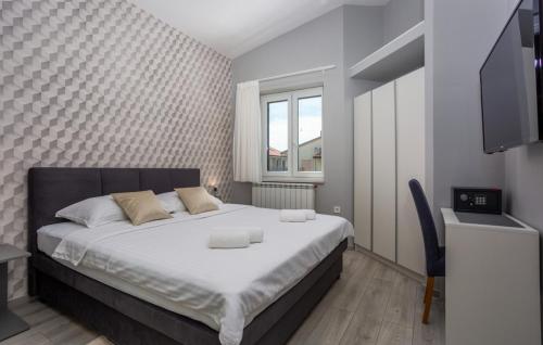 En eller flere senge i et værelse på Apartment Estate 1 - Island Krk by Villas Guide