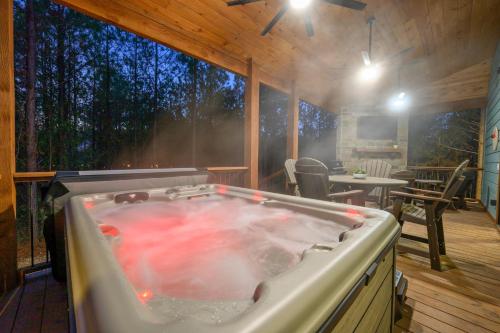 a large hot tub in the middle of a house at NEW Woodland Escape with Spa & Fire pit - Sleeps 4 in Mount Herman