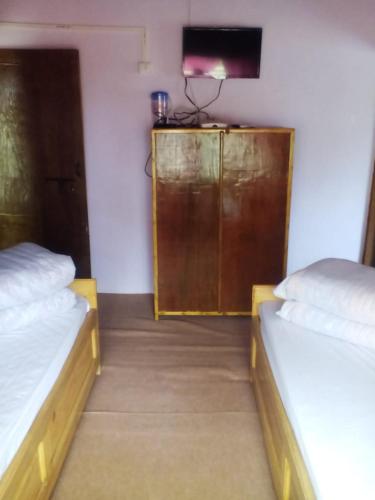 Cama o camas de una habitación en Dilpali Homestay