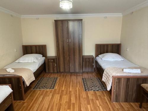 Postel nebo postele na pokoji v ubytování Nunu's Guesthouse