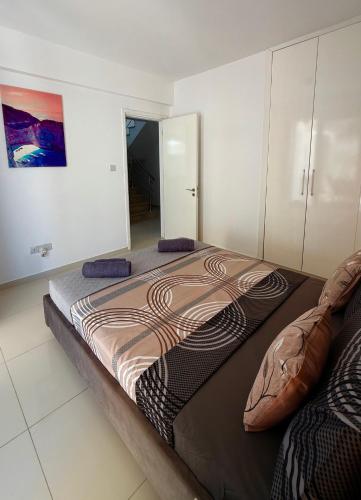 a bedroom with a large bed in a room at Amáni Seaview 3 bedrooms luxury villa in Peyia